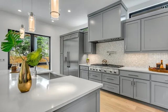 A freshly cleaned kitchen with polished counters and fixtures