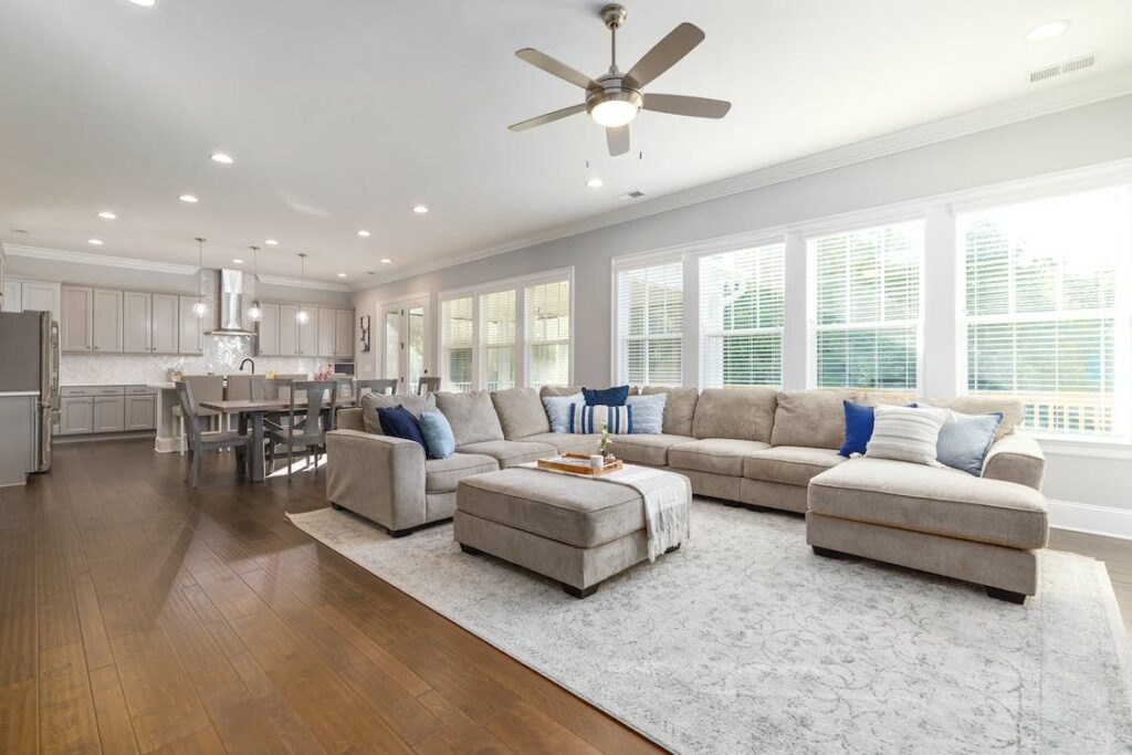 A living room adorned with a stylish decorative area rug, harmonizing with the hardwood floors in a West Chester residence