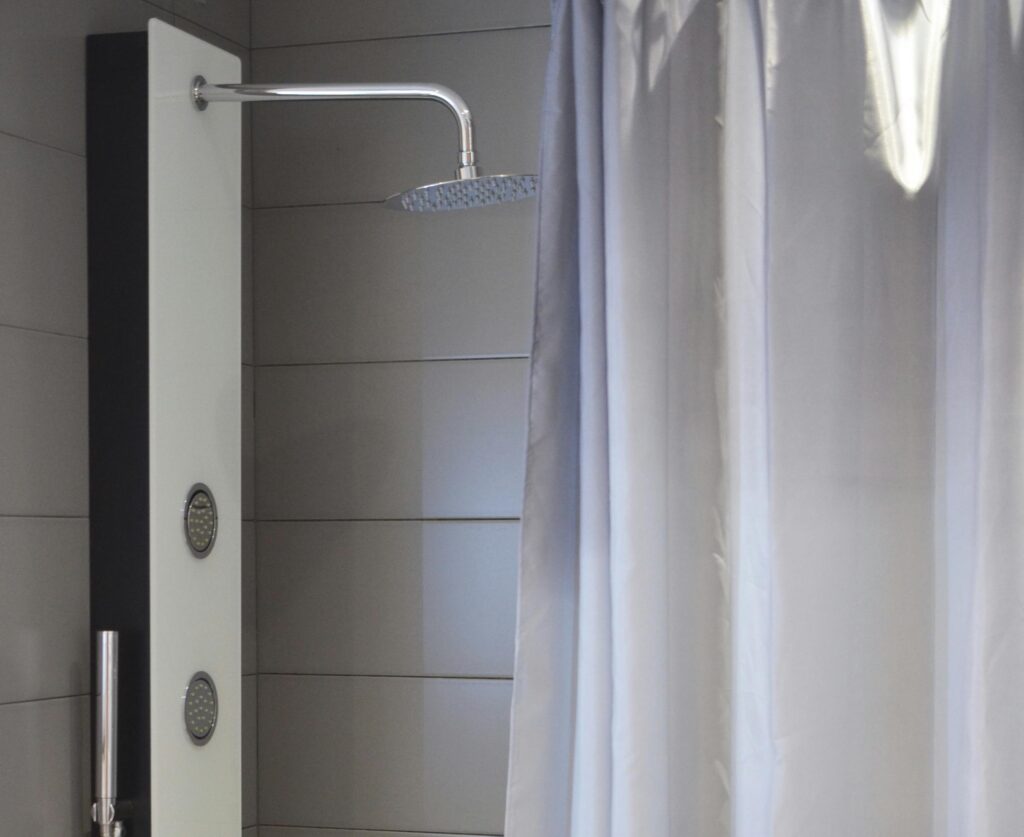 Include shower curtains and mats in your quarterly bathroom cleaning routine