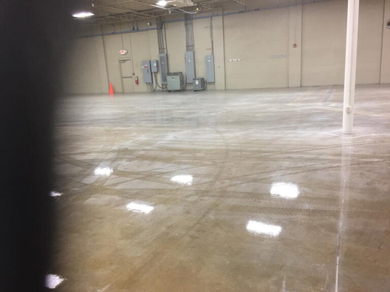 Before image of a dull concrete floor in a commercial building in Cincinnati before polishing