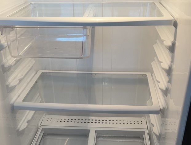 Picture of shelves in a fridge after a deep cleaning